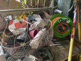 a basket full of garbage sitting on a wooden table