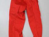 a pair of red pants sitting on top of a white table