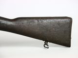 an old rifle with a wooden barrel on a white background