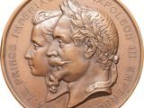 an image of a bronze medal with two heads of two men