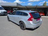 a silver car that is parked in a parking lot
