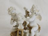 a figurine of two cherensils on a table