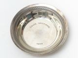 an image of a silver plate with the name of a person on it