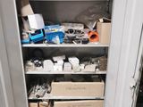 an image of a cupboard with many items in it