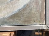 a painting that is being displayed on a easel