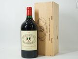 a bottle of wine sitting next to a wooden box