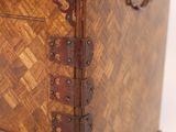 an old wooden chest with three drawers and a metal handle