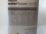a box of water flosser sitting on a table