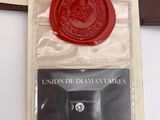 a wax seal with a red wax stamp on it