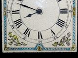 a clock with roman numerals on the face of it