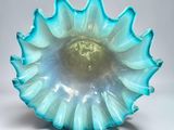 a glass bowl that is sitting on a table