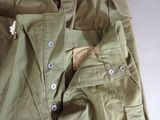 a close up of a pair of pants with buttons on them