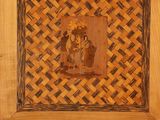 a wooden box with a picture of a man and a woman on it