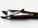 an old gun with a wooden handle on a white surface