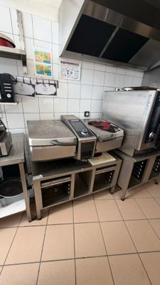 a kitchen with a lot of appliances in it