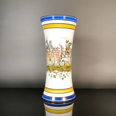a vase with a picture of a horse and carriage on it