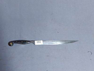 a knife that is laying on the floor with a tag on it