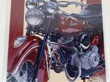 a poster of a motorcycle on display on the wall