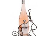 a bottle of wine sitting on top of a metal holder