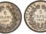 a silver coin with a laurel wreath on it