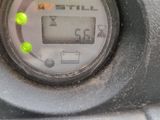 a close up of a digital meter on a car ' s dashboard
