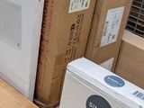 several boxes are stacked on top of each other in a warehouse