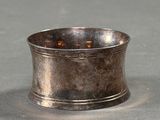 a silver cup that is sitting on a table