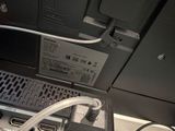 a laptop computer sitting on top of a desk next to a keyboard
