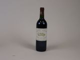 a bottle of wine that is sitting on a table