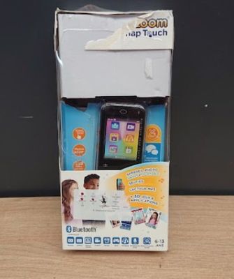 a box with a phone inside of it on a table