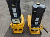 two parking meters that are sitting in the parking lot