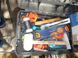 many tools in a tool box on the ground