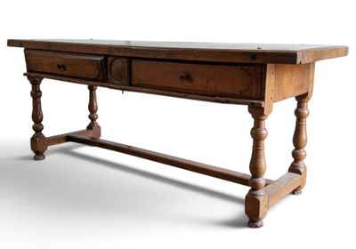 a wooden table with two drawers on top of it