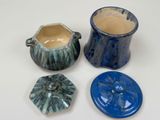 three different types of pottery sitting on a table