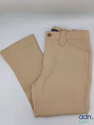 the pants are tan and have buttons on the side of them