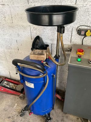 a blue bucket and a blue machine in a room
