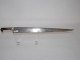 a knife that is sitting on a stand on a table