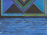 peinture abstraite représentant un motif géométrique bleu et vert sur fond noir