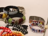 a lot of different bracelets and bracelets on the table