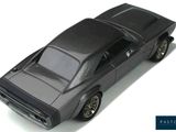 a black toy car that is sitting on a white surface