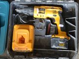 a tool box with a drill, hammer, and other tools in it