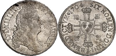 une pièce d'argent avec une croix au recto et une couronne au verso