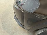 a close up of a car with a broken hood
