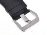 black leather watch strap with silver buckle on a white surface