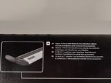 a close up of a box with a knife in it on a table