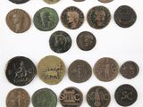 an image of a collection of old coins on a white surface