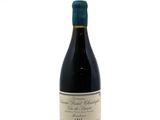 a bottle of wine that is sitting on a table