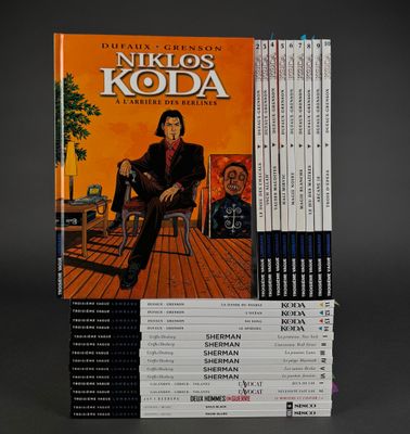 a stack of books with a picture of a man sitting on a chair