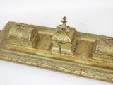a gold plate with a clock on top of it