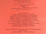 an image of a red book with black writing on it